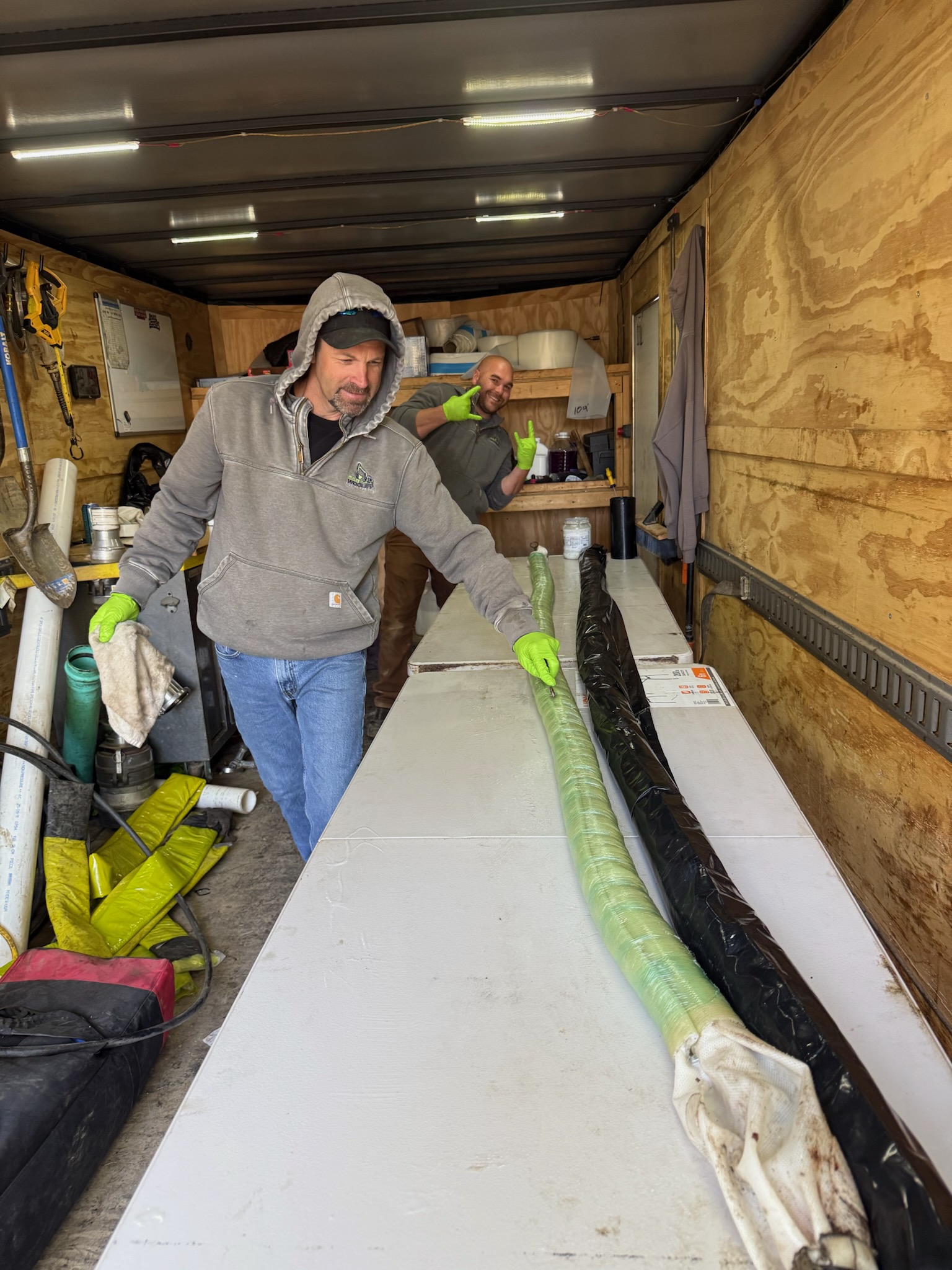 Wooley technicians prepping a CIPP liner in the work trailer